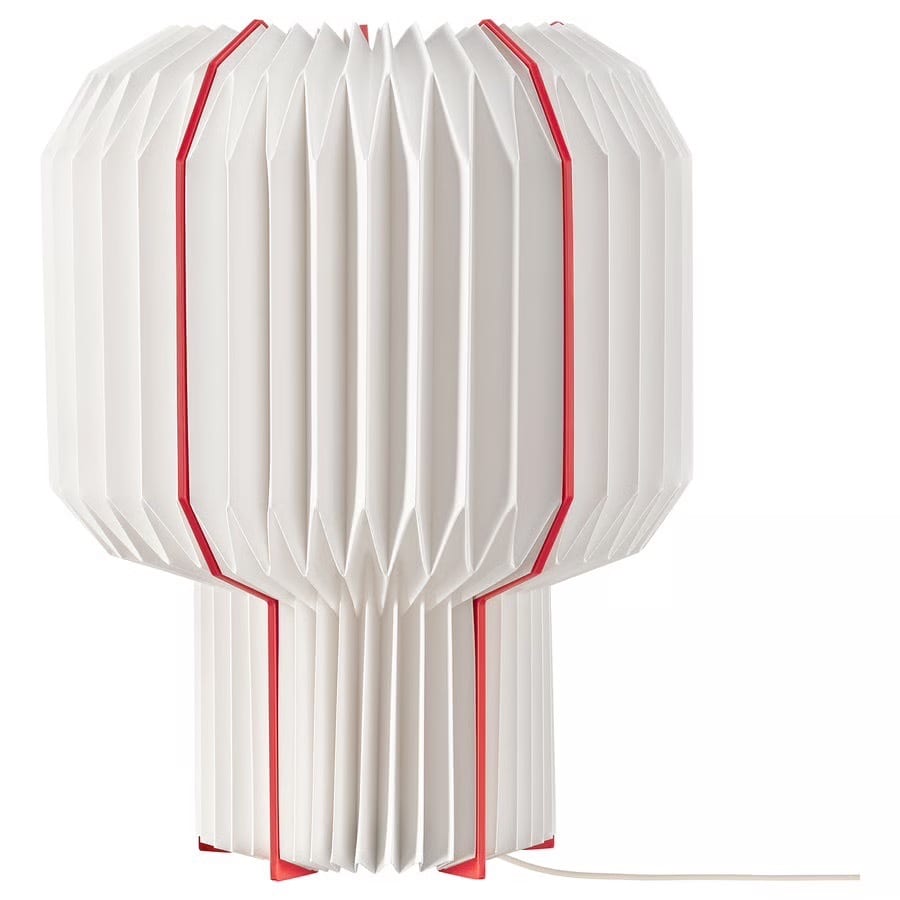 White pleated lamp with red vertical lines.