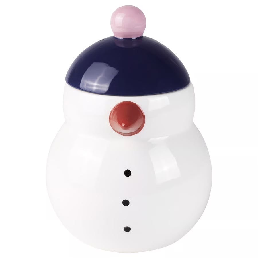 White snowman jar with dark blue lid, pink knob, red nose, and three black buttons.