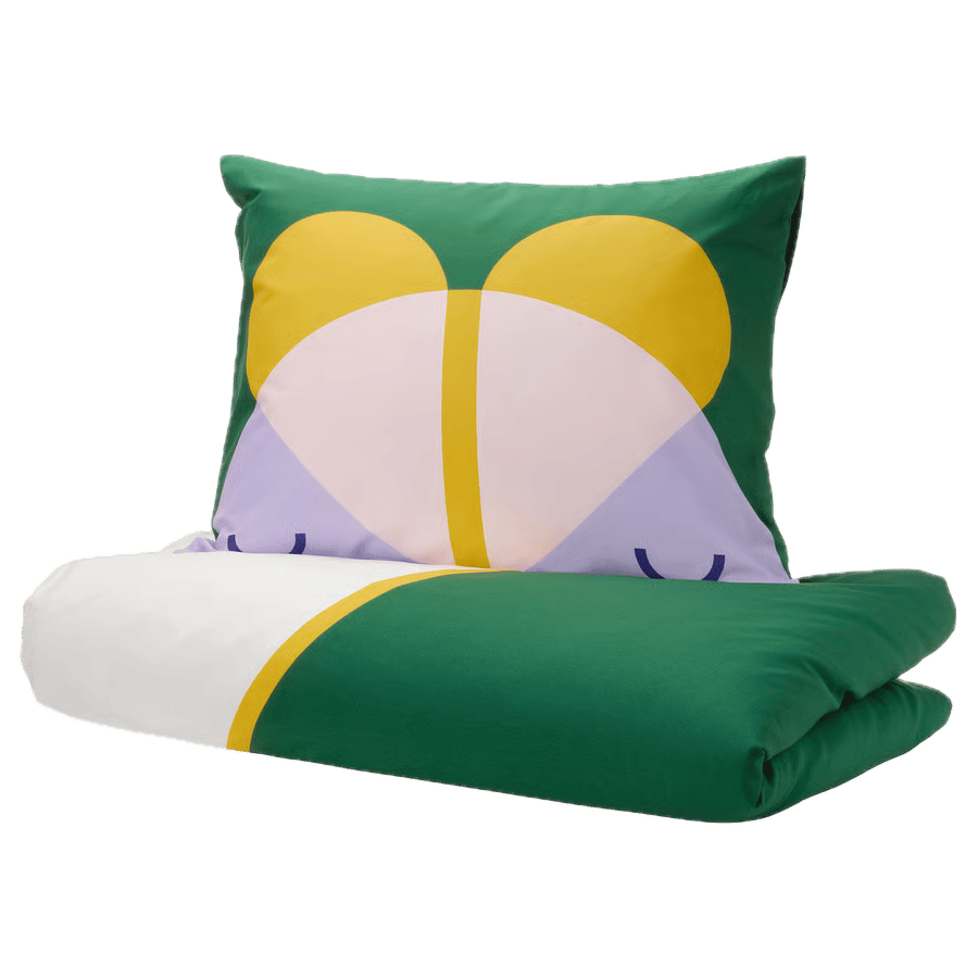 Green pillow with abstract yellow, pink, purple pattern & matching folded duvet.