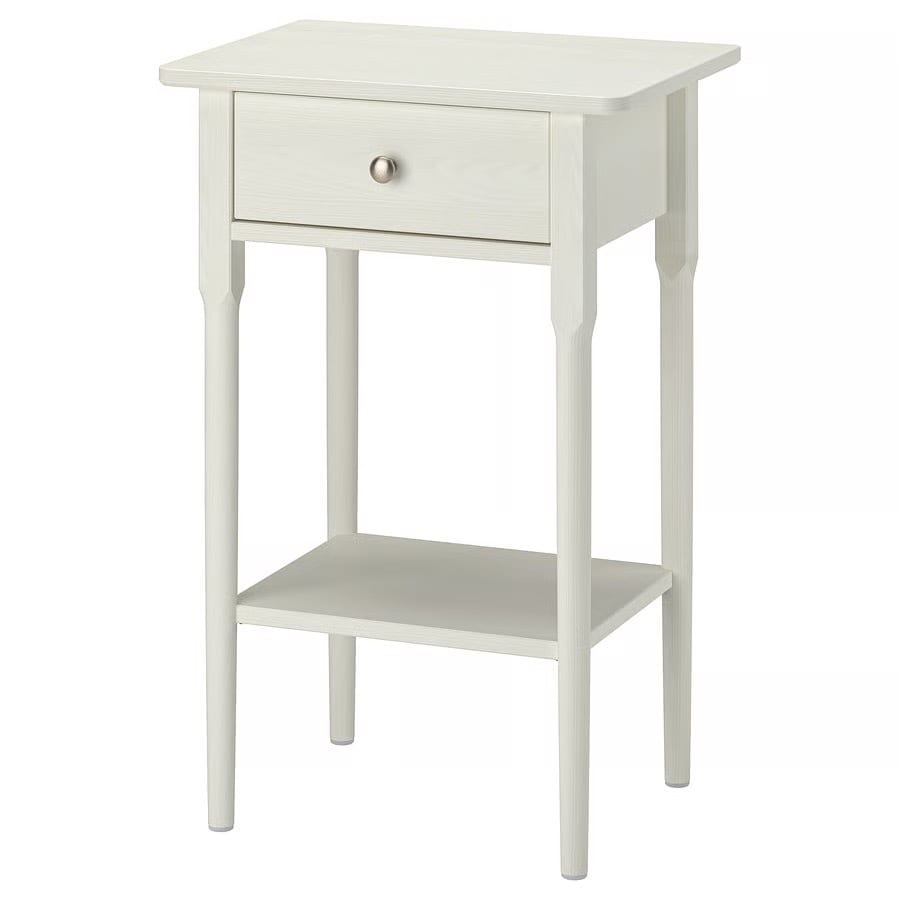 White wooden side table with a drawer and lower shelf.