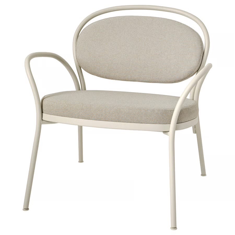 Cream-colored armchair with a curved metal frame and light beige fabric cushions.