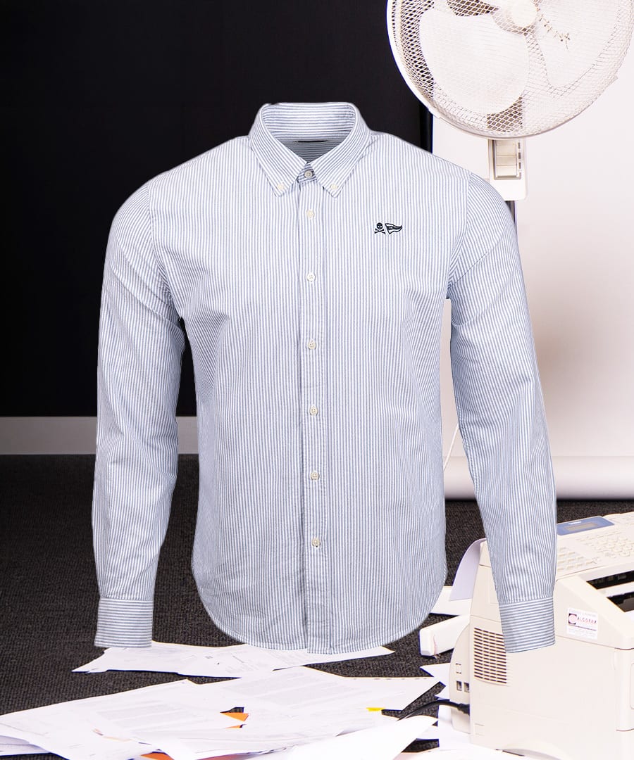 Light blue and white striped long-sleeve button-down shirt with a small black emblem on the chest.