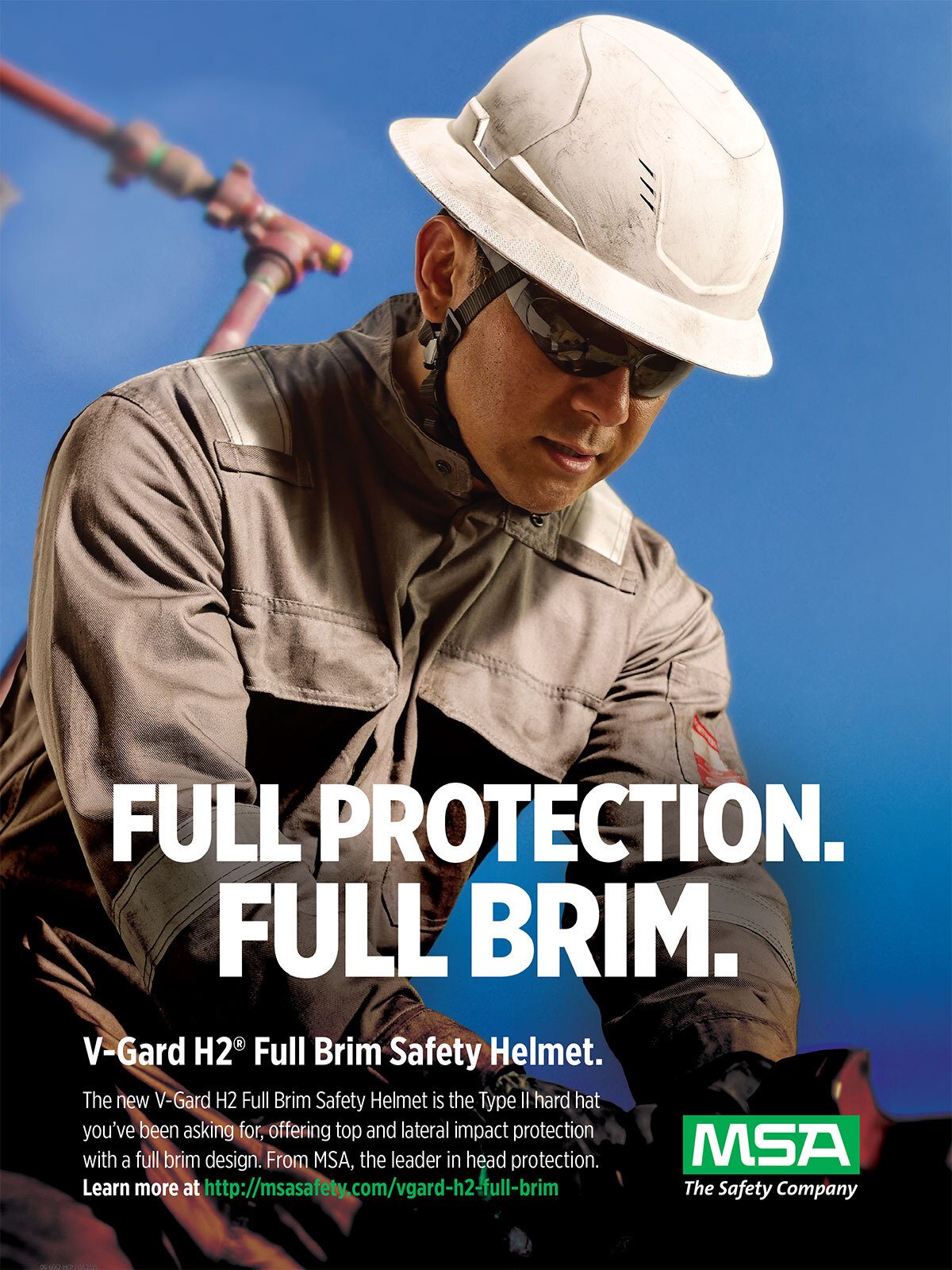 Worker wearing a V-Gard H2 Full Brim Safety Helmet and safety glasses, with text "FULL PROTECTION. FULL BRIM."