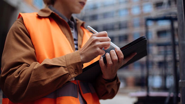 Hand, Outerwear, Orange, Gesture, Finger, Microphone