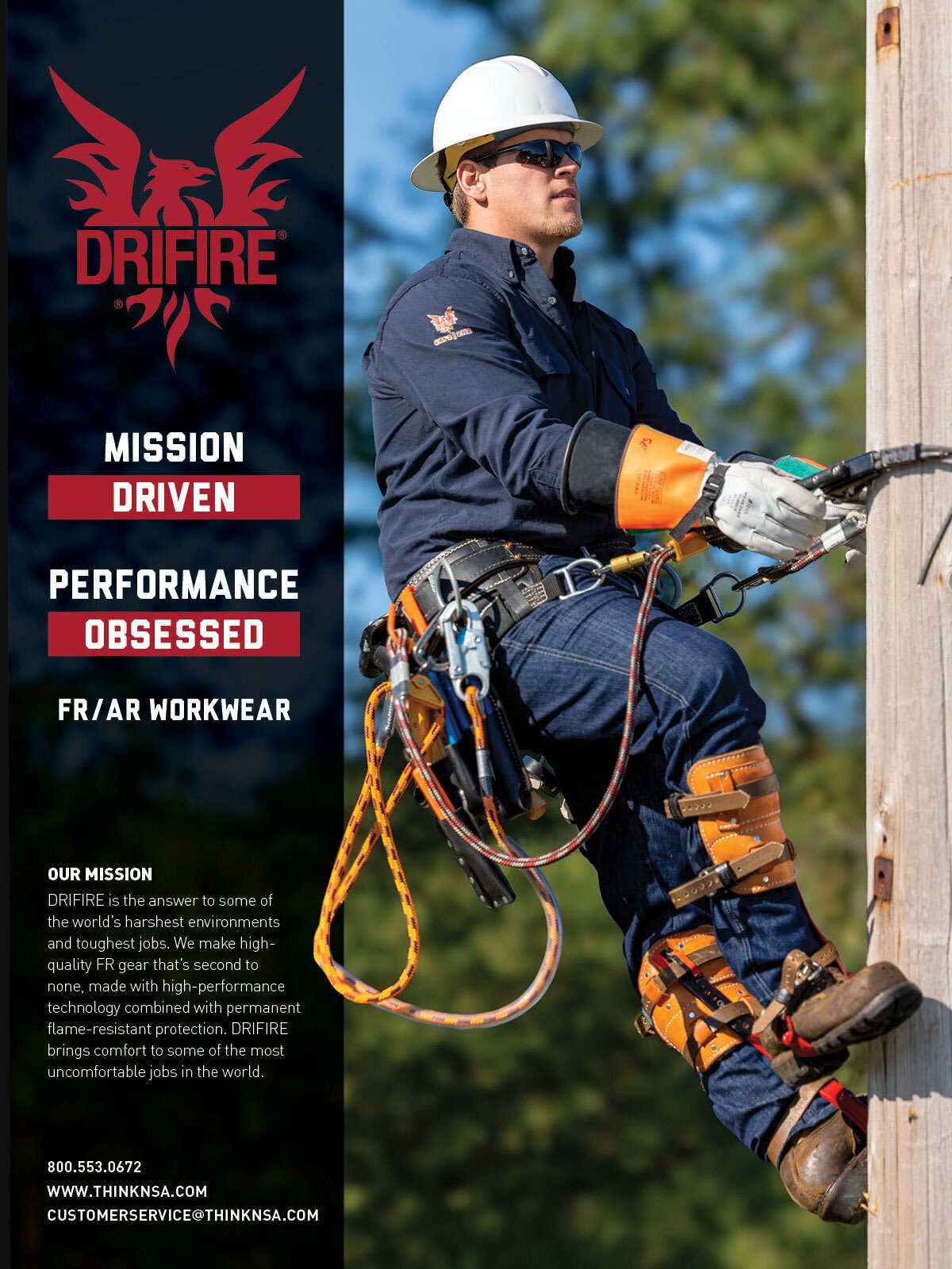 Utility worker in DRIFIRE FR/AR workwear and safety gear climbing a utility pole.