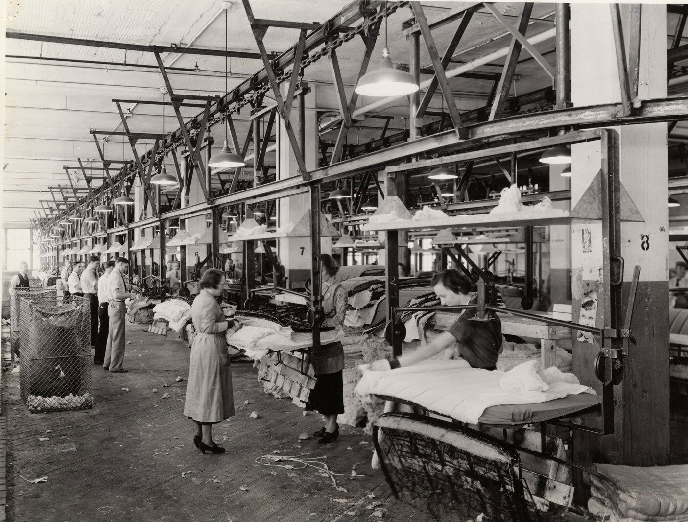 Vintage textile factory: workers on an assembly line.