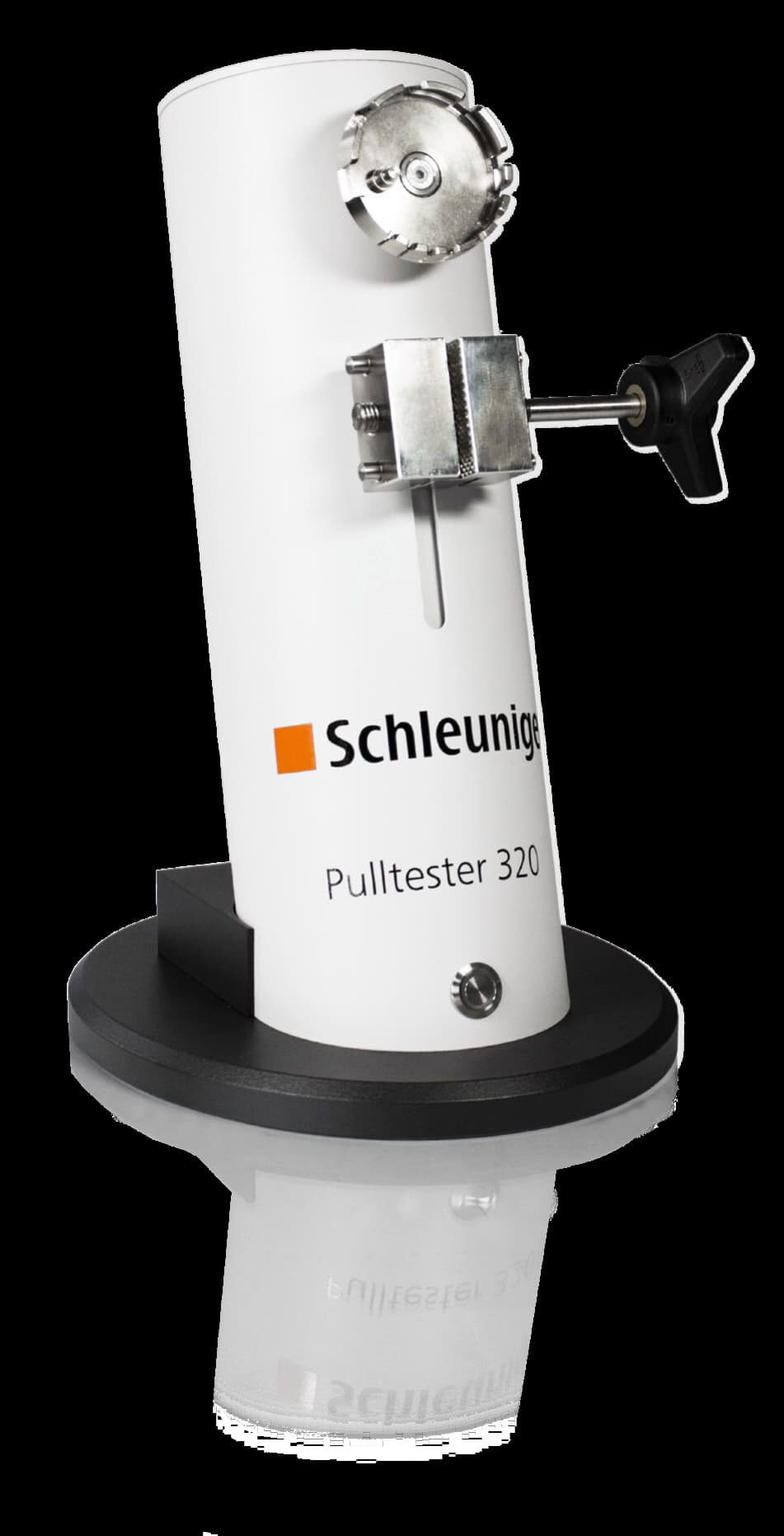 A white Schleuniger Pulltester 320 device with metallic clamps and a rotating mechanism.
