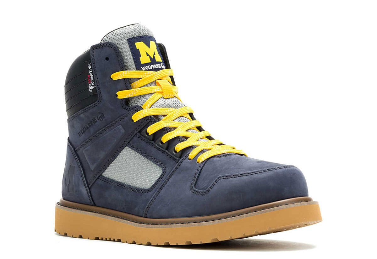 Blue Wolverine waterproof work boot with yellow laces and tan sole.
