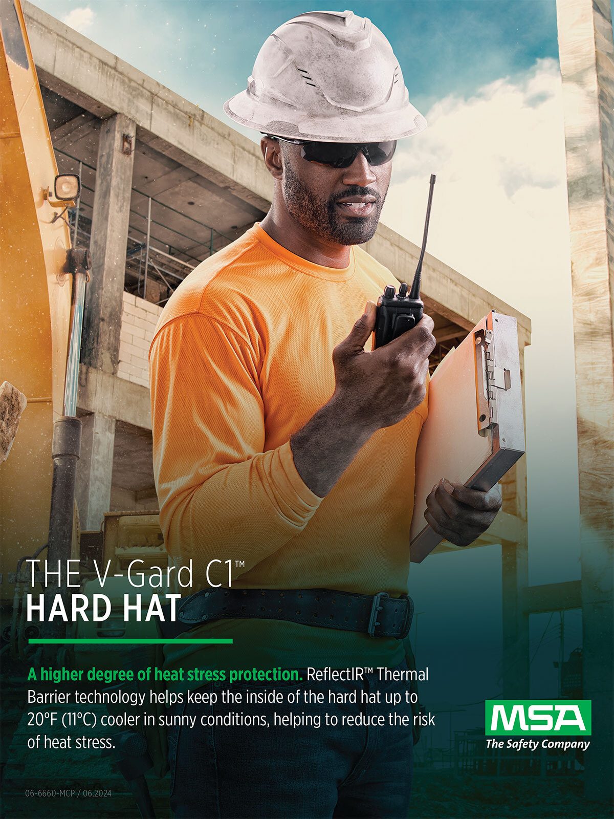 Man in V-Gard C1 hard hat at construction site, promoting heat protection.