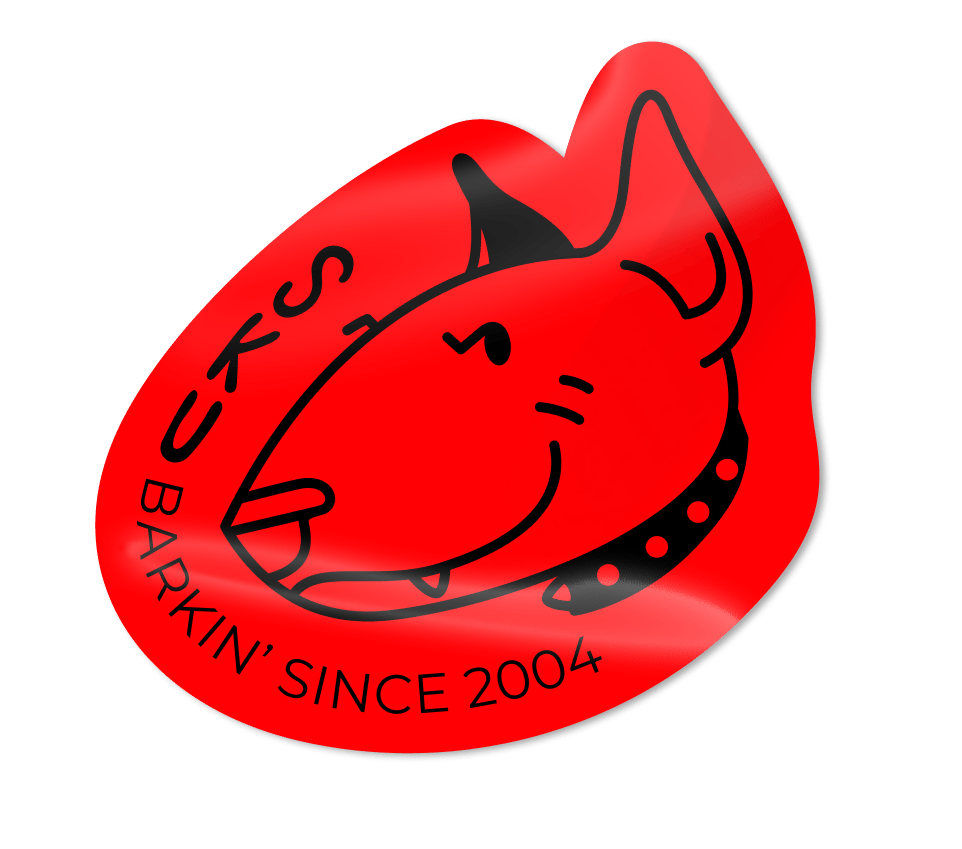 Red sticker featuring a black outline of a bull terrier's head and 'BUKS BARKIN' SINCE 2004' text.