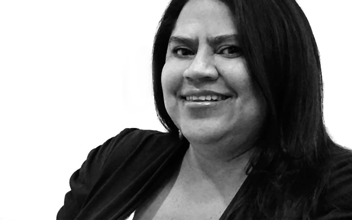 Smile, Hair, Cheek, Head, Lip, Glasses, Chin, Outerwear, Eyebrow, Shoulder