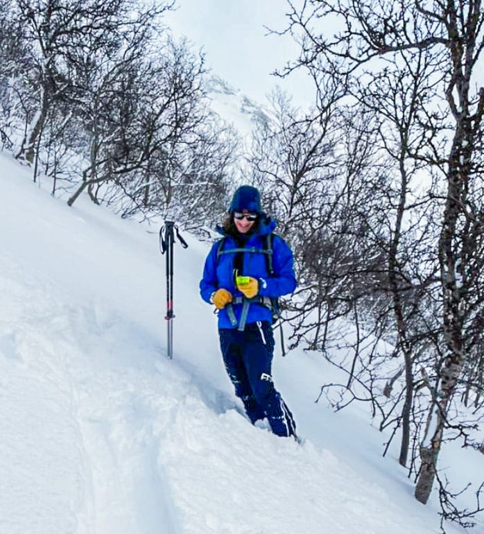 Sports equipment, Winter sport, Ski pole, Ice cap, Sky, Snow, Tree, Slope, Hat