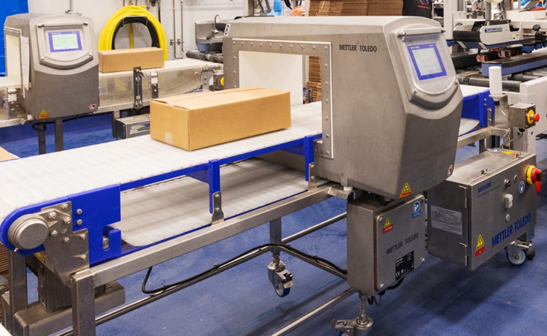 Mettler-Toledo inspection machine running corrugated packaging on conveyor