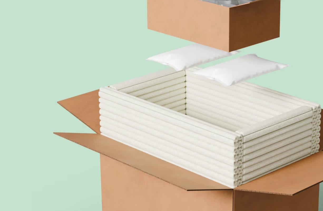 Image of TemperPack’s Green Cell Foam being pulled out of a corrugated carton.