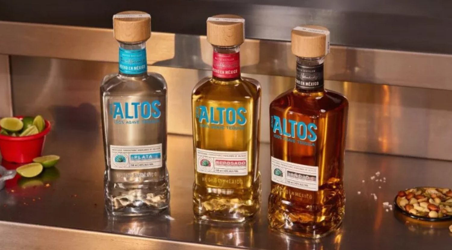 Assortment of Altos tequila bottles on bar shelf