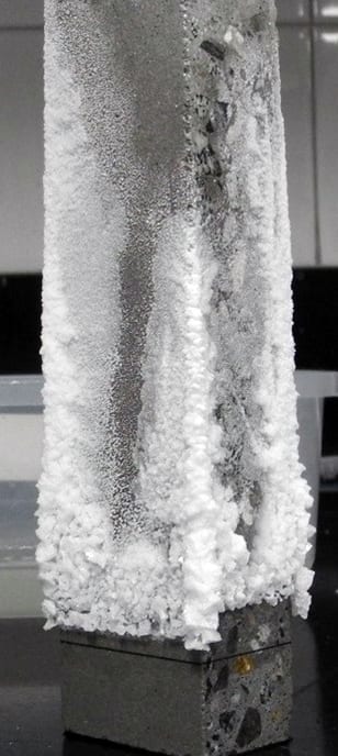 Relative efflorescence performance of two acrylic latex polymers of varying particle size and one solvent-based solution polymer.