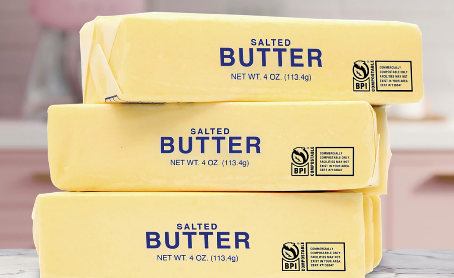 Stack of three sticks of butter in Novolex packaging