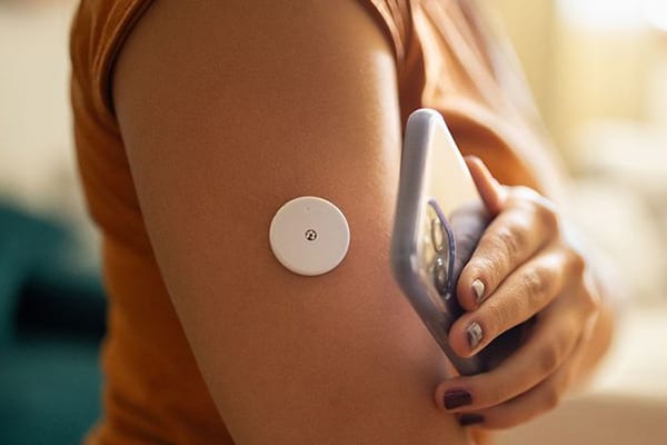 Woman monitoring glucose level