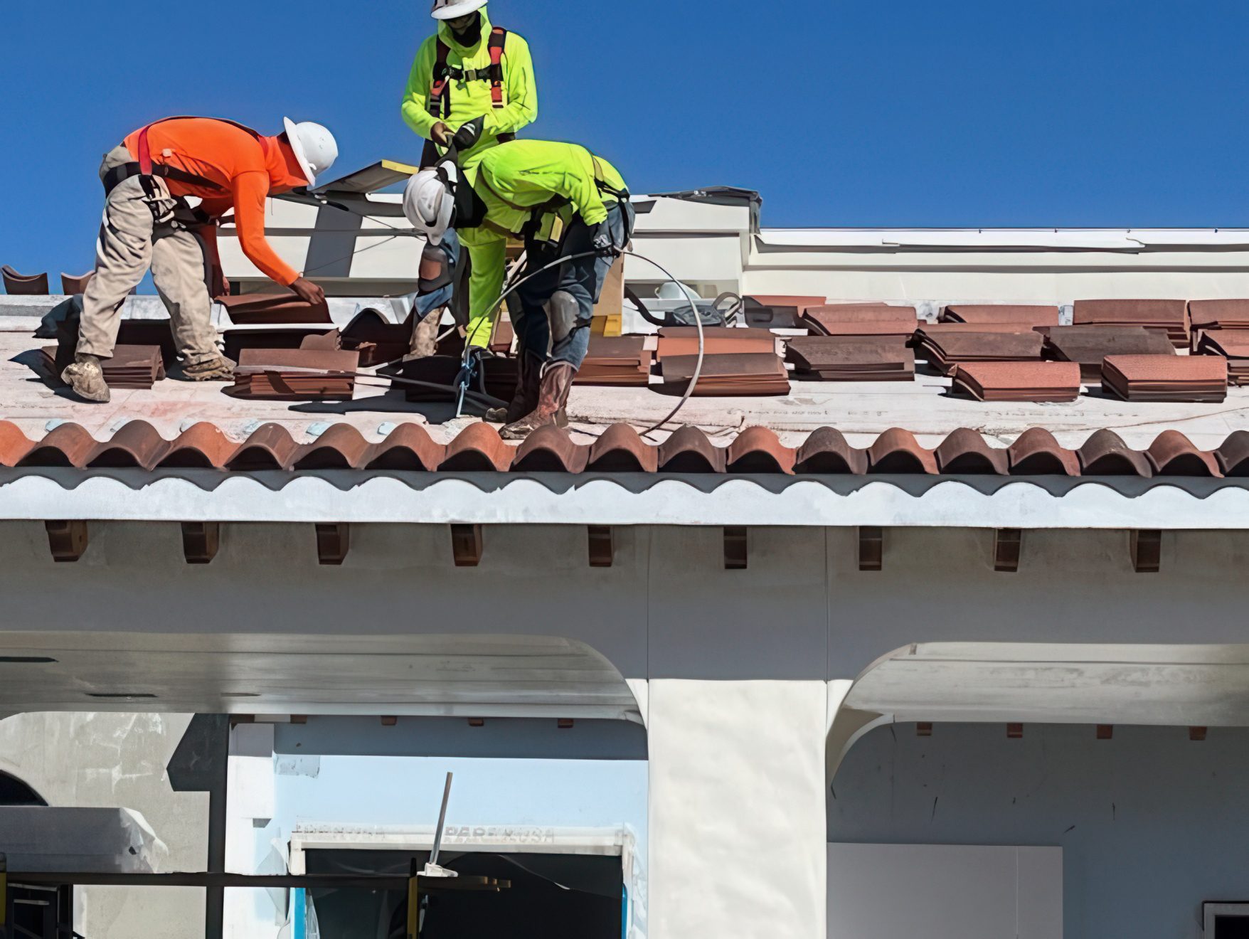 Workers on the roof of the In-N-Out building