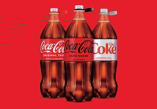 Coca-Cola bottles with attached caps