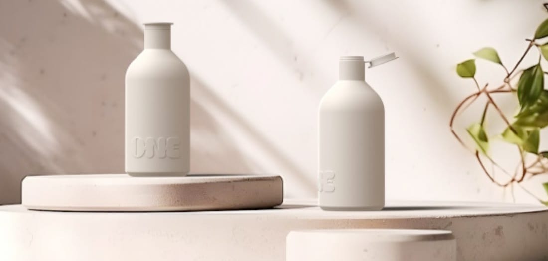 Pair of ONE containers with open lid in bathroom setting