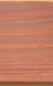 Reddish-brown wood grain texture.Appearance of low-sheen clear coating formulated with MT-8 and a control commercial acrylic coating. Three brush-applied coats over redwood