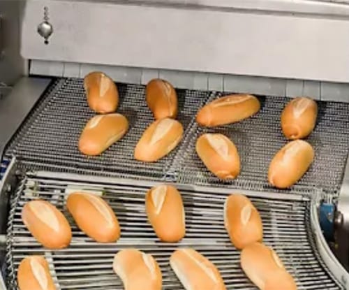 Baked goods going through cryogenic machinery