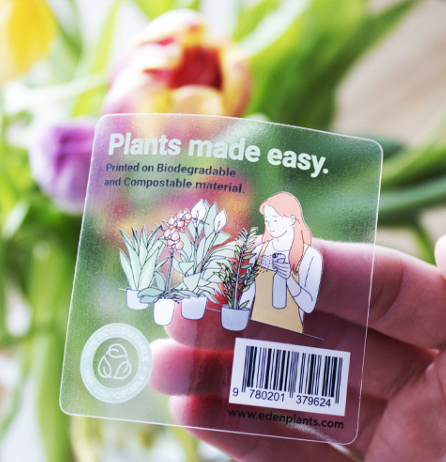 Hand holding clear adhesive label
