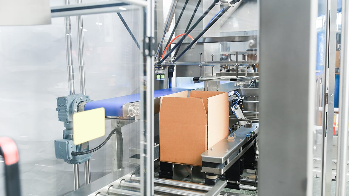 Image of the Robopacker case-packing system erecting a case