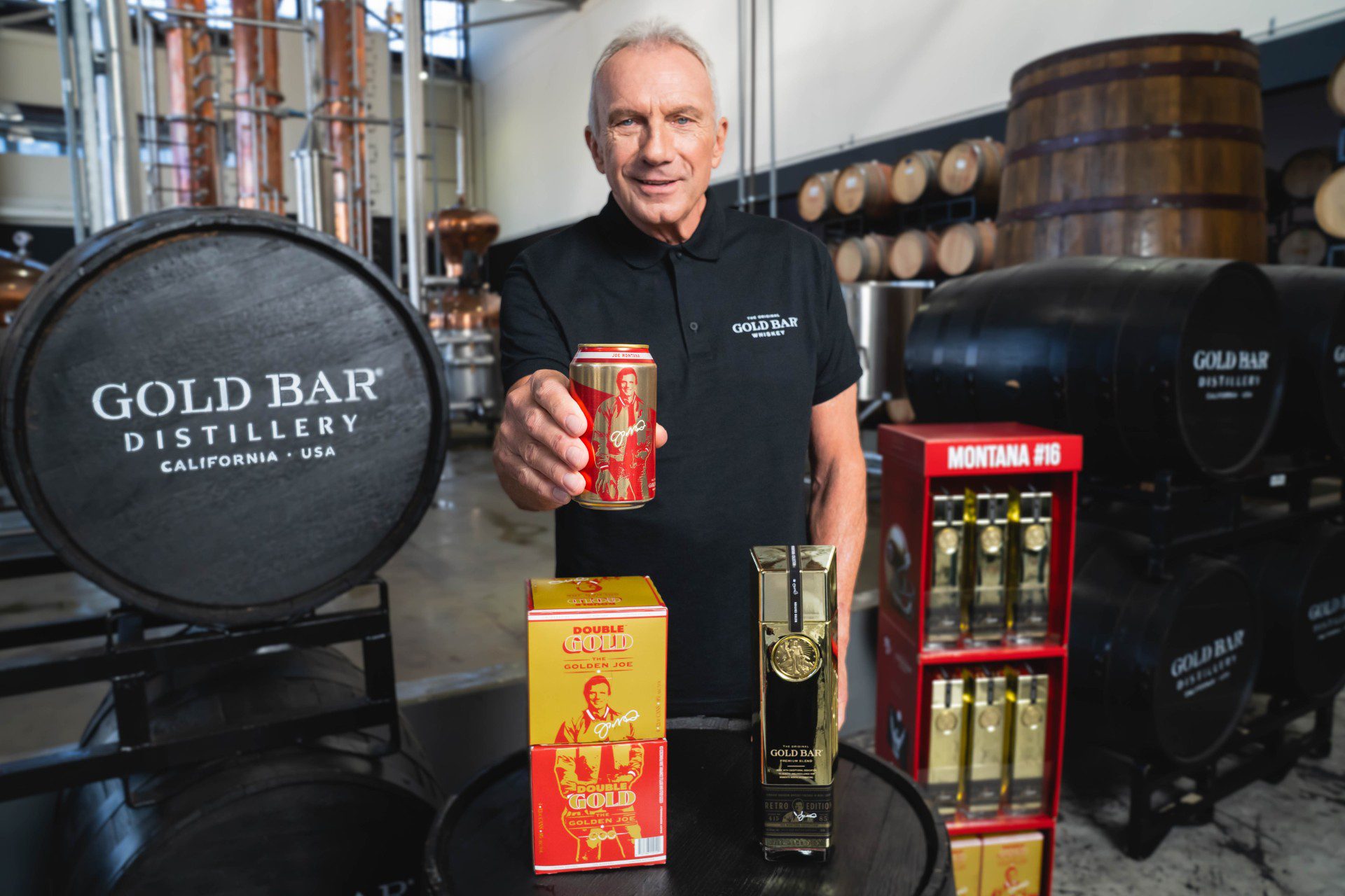 Joe Montana holding can of his Double Gold Whiskey
