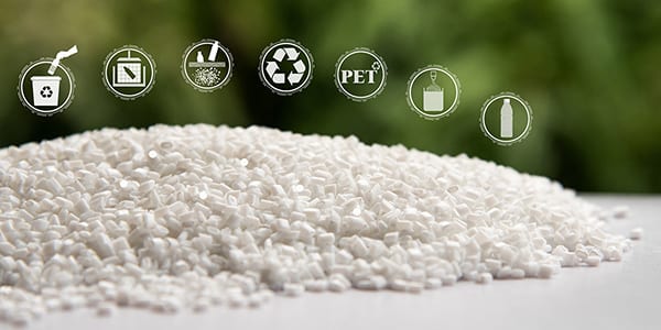 White Pet chips with blurred green background and recycling icons 