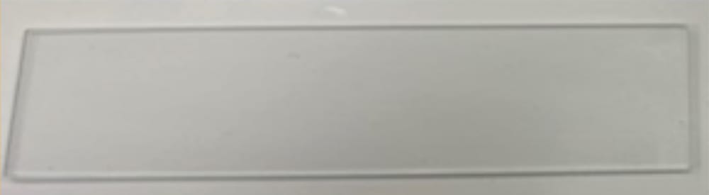 Rectangular clear glass slide.