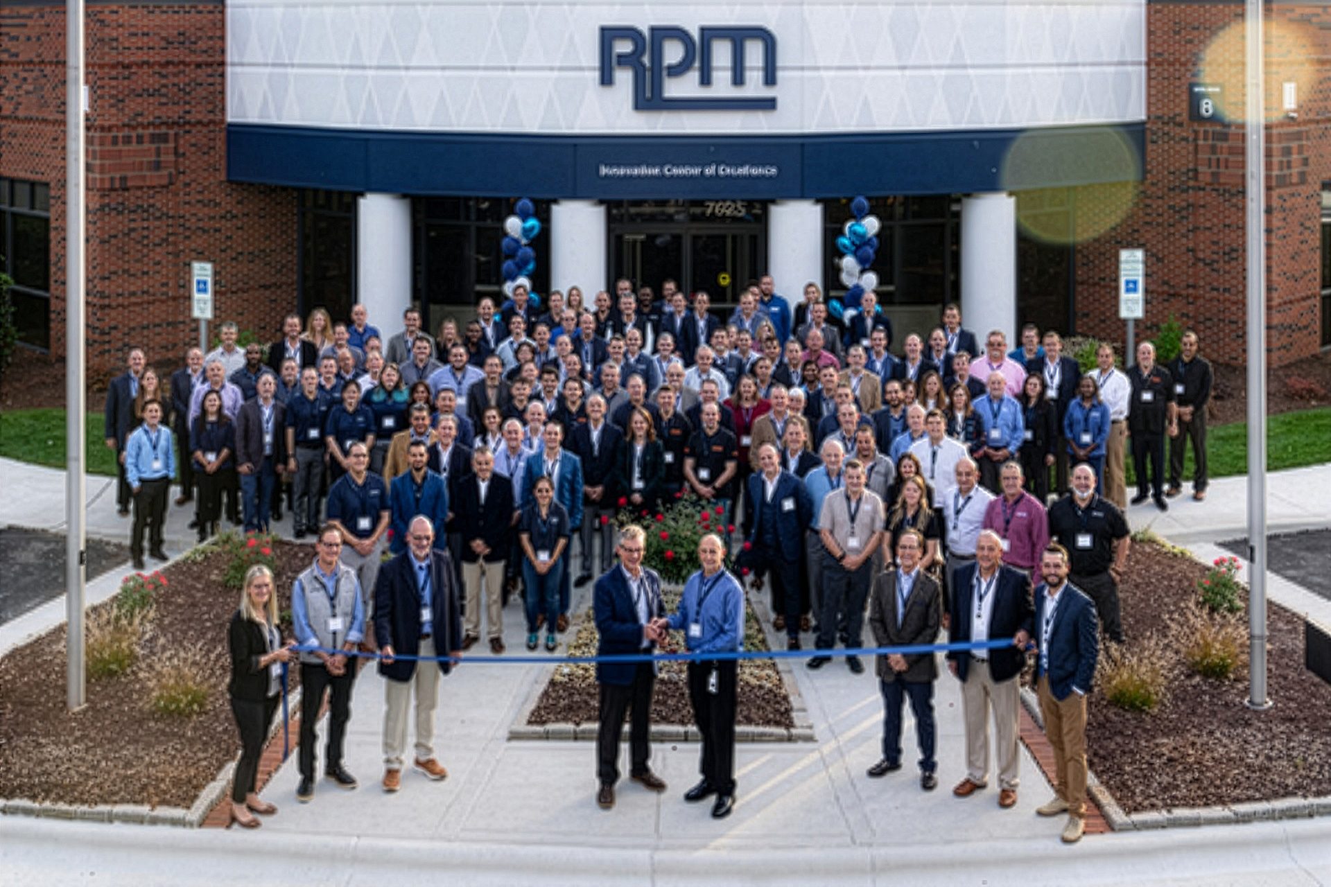 Large group at RPM Innovation Center ribbon-cutting ceremony.