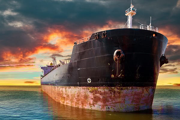 Big ship at sea on a background of sunset sky