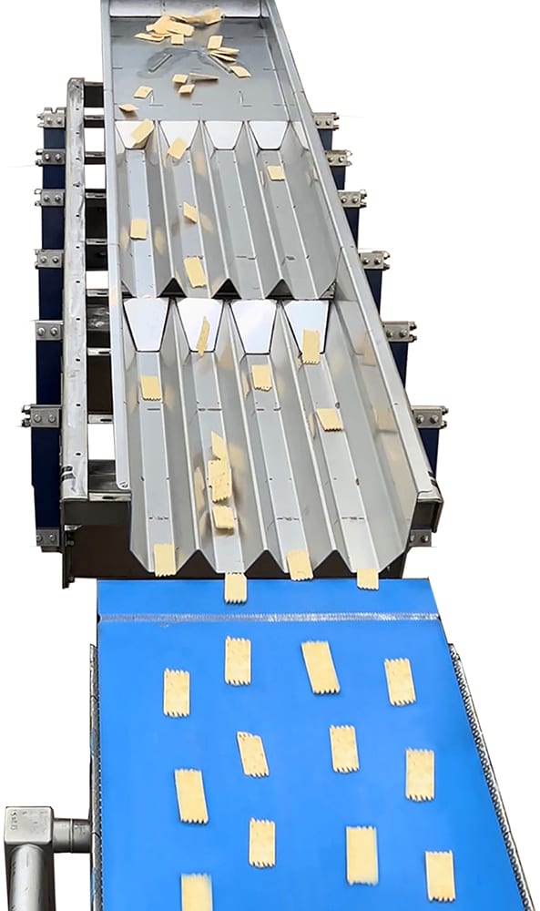 Items being propelled on conveyor