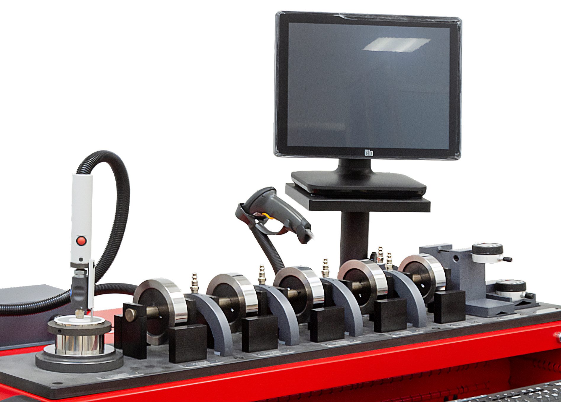 An industrial machine featuring rotating components, a monitor, a barcode scanner, and a probing tool.