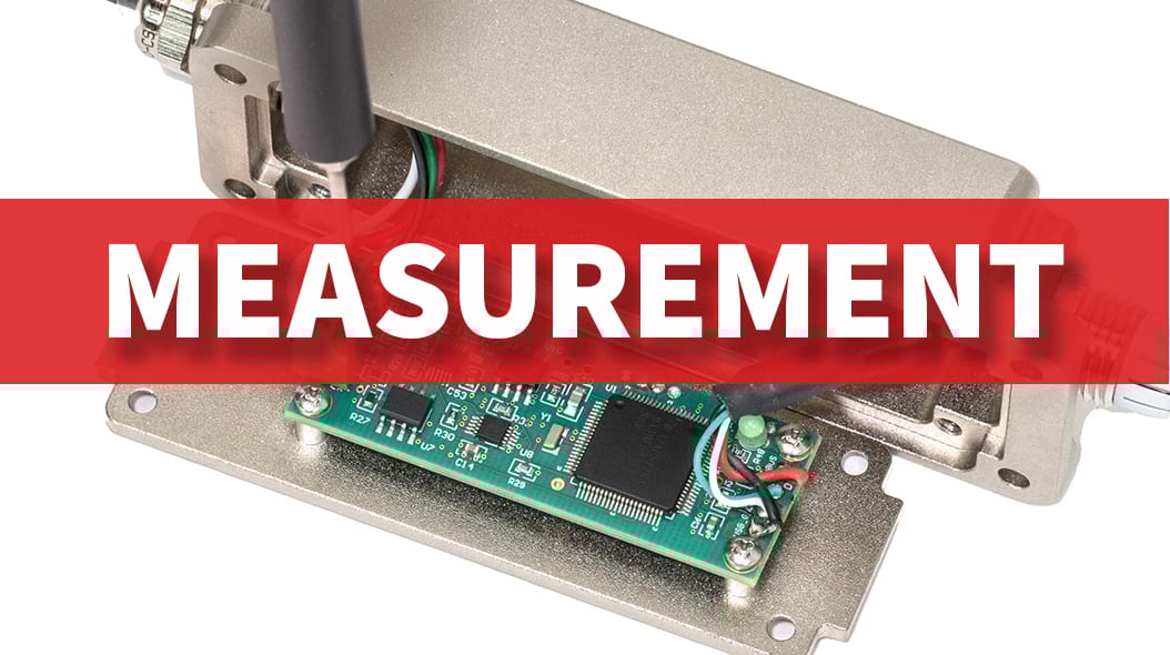 Close-up of a circuit board within a metal casing, with 'MEASUREMENT' text overlay.