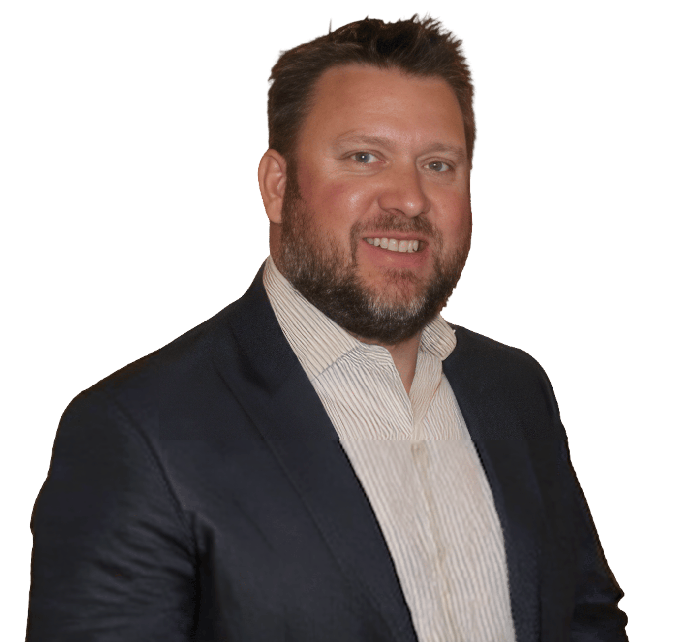 Headshot of a smiling man with a beard wearing a dark suit jacket and striped shirt.