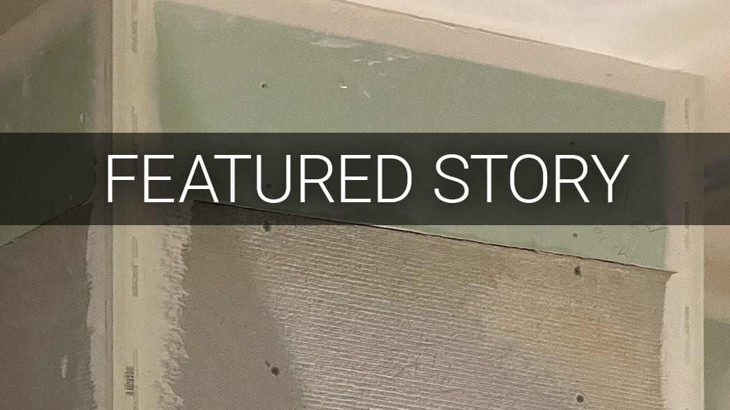 Unfinished wall construction (drywall/cement board) with "FEATURED STORY" text overlay.