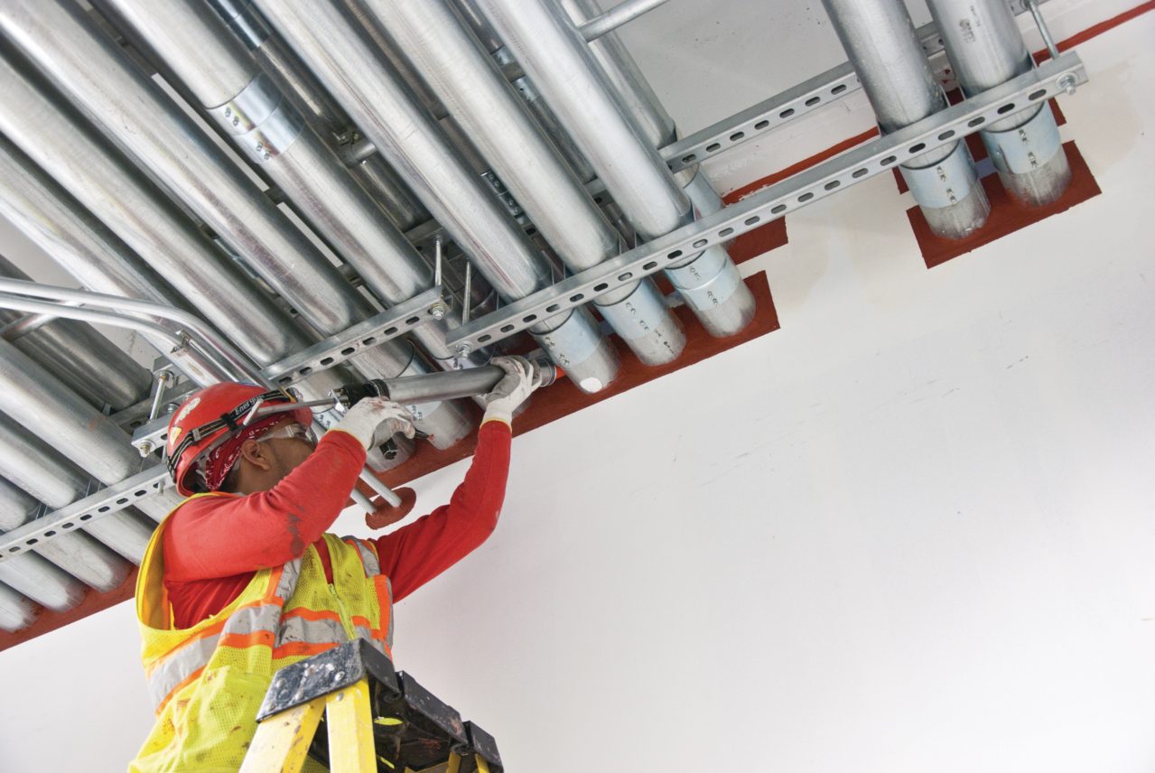 Worker installing Fire Prevention product