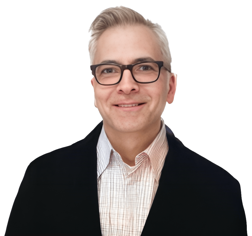 Smiling man with glasses and light hair in a dark jacket.