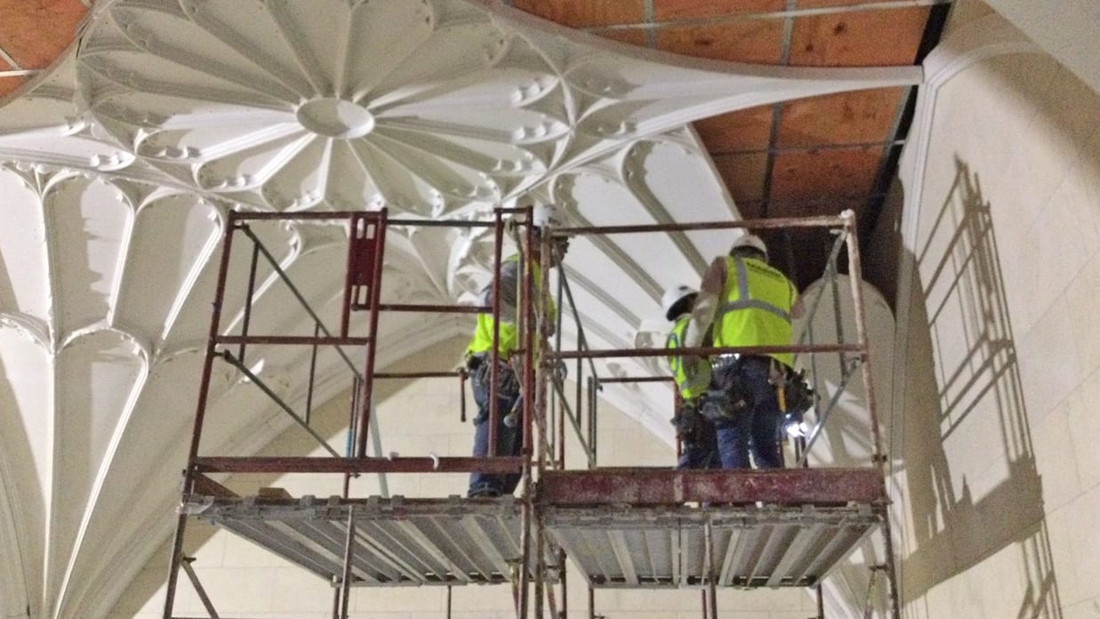 Workers installing ceiling at Lanier Theological Library