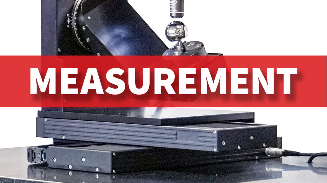 Close-up of industrial measurement equipment with a prominent red banner displaying 'MEASUREMENT'.