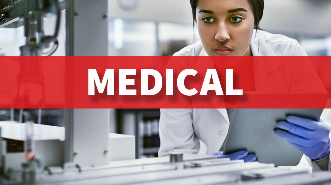 Female scientist in lab coat and gloves using a tablet in a laboratory with a 'MEDICAL' banner overlay.