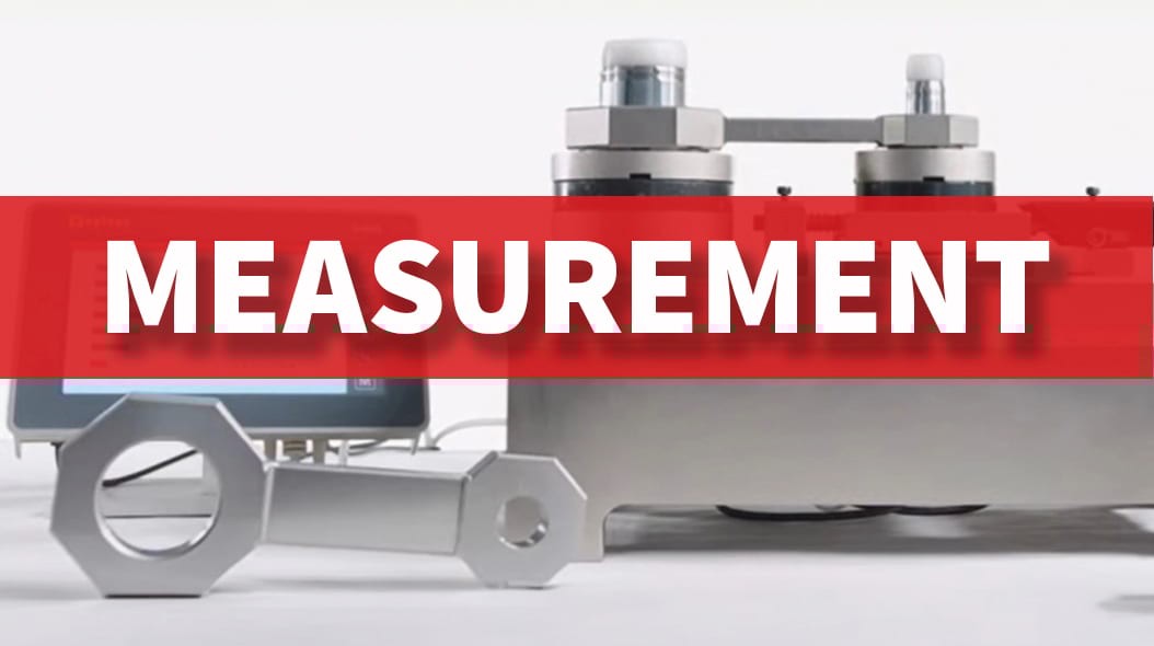 Red banner with "MEASUREMENT" text over precision tools and a display screen, indicating quality control.