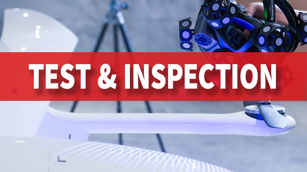 Text "TEST & INSPECTION" on a red banner, with a 3D scanner and part of a drone in the background.