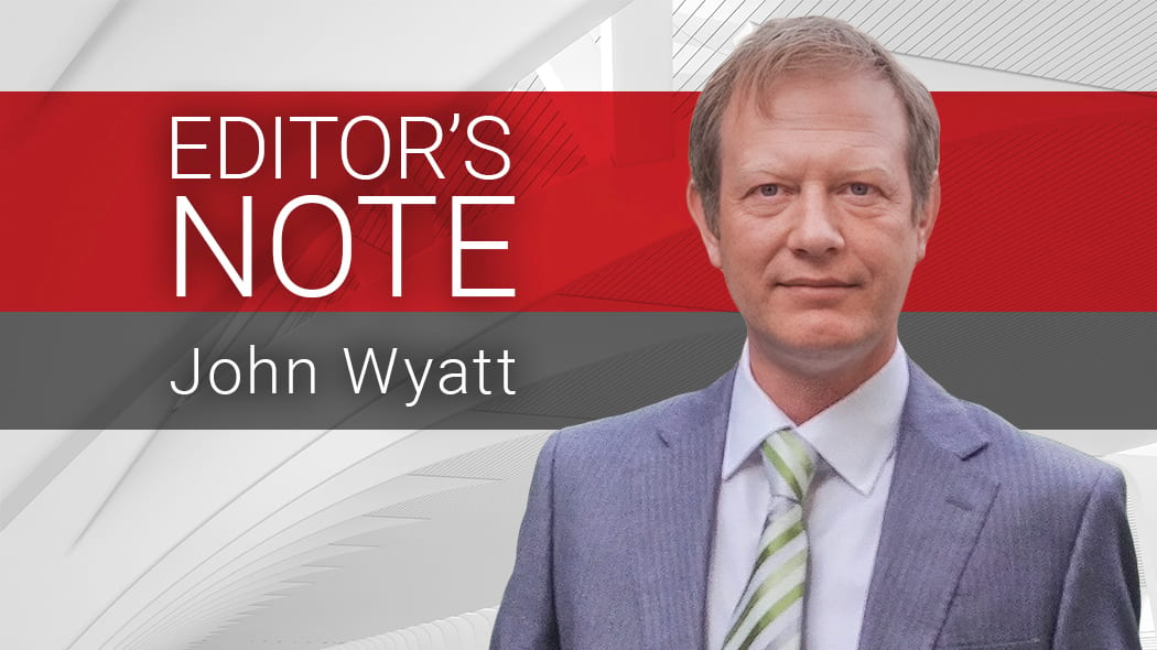 John Wyatt, an editor, smiles in a suit, with a red and gray banner featuring "EDITOR'S NOTE."