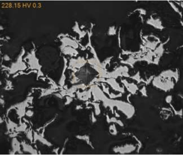 Abradable coating, showing difficult placement of HV0.3 indent