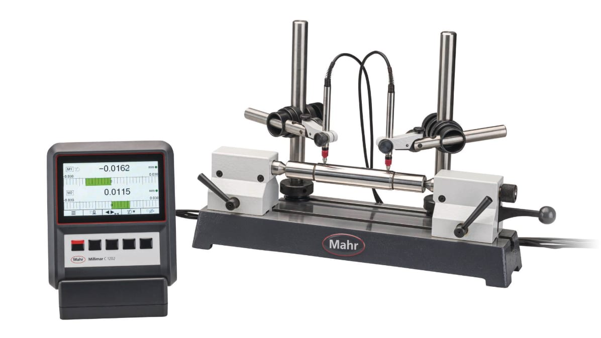 Mahr precision measuring stand with digital display measuring a cylindrical shaft.