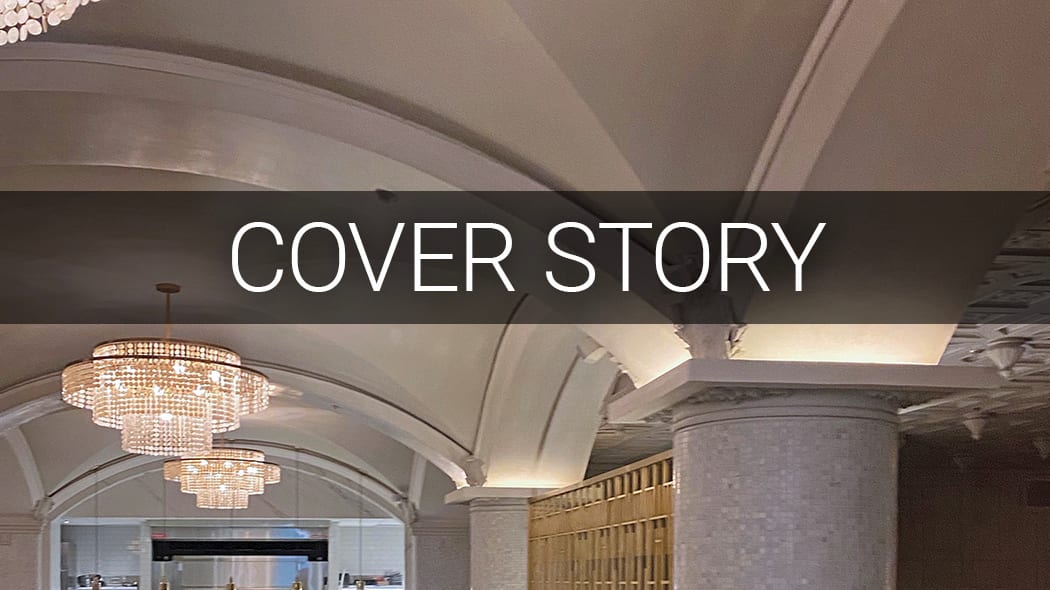 Elegant interior with vaulted ceilings, crystal chandeliers, and decorative pillars, overlaid with "COVER STORY" text.